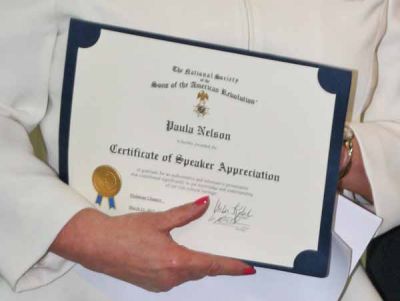Vice President Rick Reese presents guest speaker Paula Nelson with a Certificate of Speaker Appreciation.